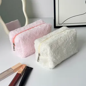 Pink and white plush makeup bags in soft faux fur with high-capacity zipper closure