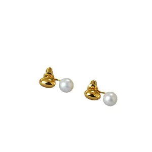 Elegant 18k gold plated brass earrings featuring round freshwater pearls with 925 silver pins