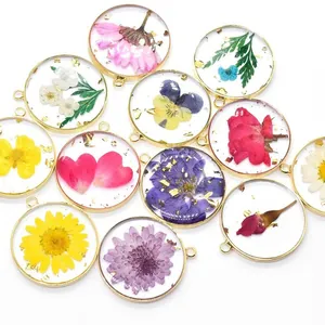 Handmade real dried flower resin pendants with gold foil in round copper frames for DIY