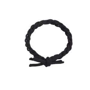 Elastic braided hair tie in black with spiral texture and a matching bow decoration
