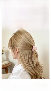 Close-up of pink mosaic patterned acetate hair claw clip worn on model hair side