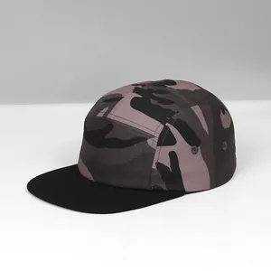 Side view of five-panel camper hat with camouflage pattern and black flat brim