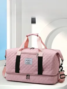 Pink quilted sports bag detail showing bottom zipper compartment for wet and dry separation