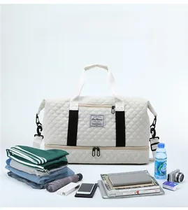 Detail of white quilted travel bag showing dry-wet separation and large storage capacity