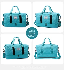 Detail view of lake blue quilted sports bag with separate bottom shoe compartment