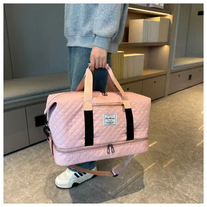 Pink quilted yoga travel bag with a separate bottom compartment for shoes and wet items