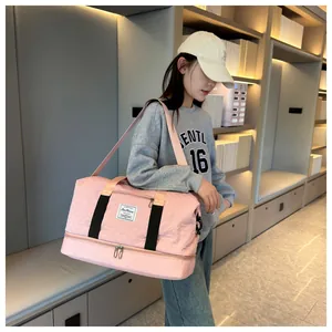 Pink quilted sports duffel bag with black straps and adjustable shoulder strap for travel