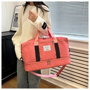 Pink quilted travel bag featuring dry-wet separation and a dedicated bottom shoe compartment