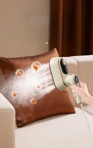 Detail view of portable handheld garment steamer smoothing a velvet pillow with steam