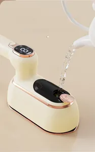 Detail of water pouring into the large tank of a portable handheld garment steamer