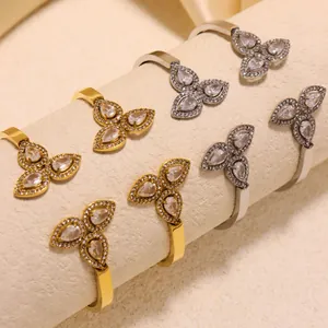 Elegant 18k gold and silver stainless steel spring bangles with zircon clover design