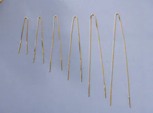 Detail view of gold S925 silver box chain threader earrings in multiple lengths