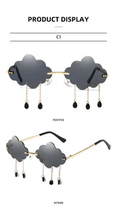 Close-up of cloud-shaped rimless sunglasses with dark lenses and metal raindrop charms