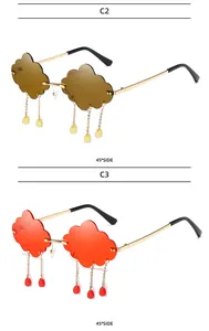 Detail of cloud-shaped rimless sunglasses with gold chains and hanging raindrops