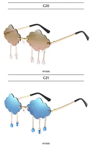 Detail of rimless cloud sunglasses with dangling raindrop charms and golden metal temples