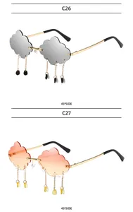Detail view of cloud-shaped sunglasses with metal raindrop tassels and gradient lenses