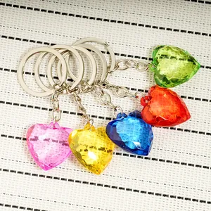 Set of five colorful faceted acrylic heart keychains in pink yellow blue red and green