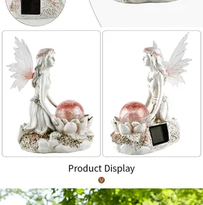 Detail view of solar fairy statue with pink cracked glass ball and back solar panel