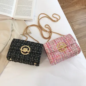 Elegant tweed crossbody bag with gold chain strap and ring lock in black and pink colors