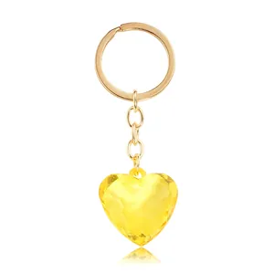 Chic yellow heart faceted crystal keychain with golden metal ring and soft mirror reflection