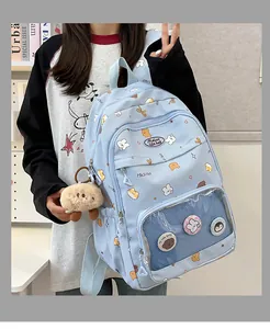 Side view of light blue school backpack with cute animal prints and clear window pocket
