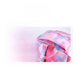 Detail of padded top handle and pink breathable mesh on a starry gradient school backpack