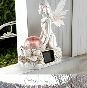 Solar flower fairy garden ornament detail with pink crackle glass ball and resin wings