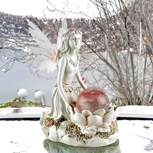 Solar flower fairy garden statue with cracked glass ball and delicate resin wings