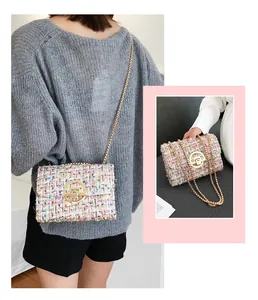 Detail of pink tweed shoulder bag with golden chain strap and metallic twist-lock closure