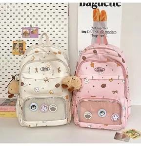 Detail view of large school backpacks with transparent window for anime badges and charms