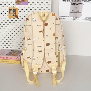 Cute Korean style beige school backpack with cartoon prints and adjustable straps
