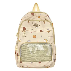 Cute school backpack with bear prints and a transparent front pocket on white background