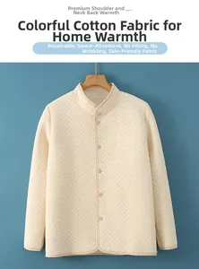 Detail of light beige quilted cotton thermal vest with high collar and button closure