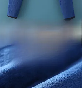 Macro detail of triple-layer thickened flannel fabric showing soft texture and breathability