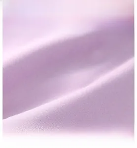 Close-up of light purple warm shoulder wrap featuring breathable and elastic fabric texture