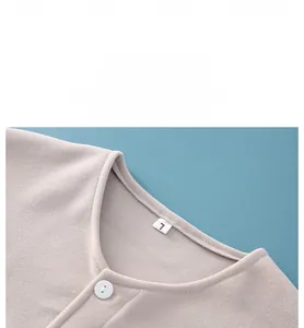 Detail of warm thermal shoulder protector with soft fleece fabric and button closure