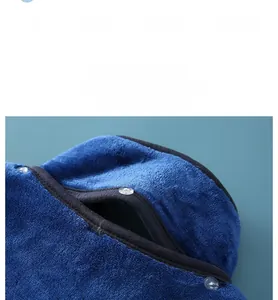 Detail view of thickened flannel shoulder protector with transparent snap closure for warmth