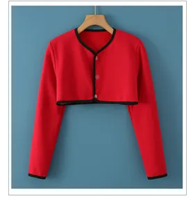 Detail view of red thermal shoulder warmer with black trim and soft fleece lining