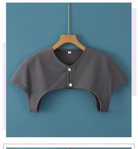 Close-up of dark grey thermal shoulder wrap featuring white buttons and a size L tag