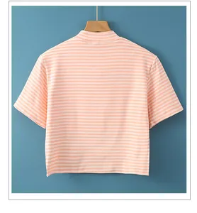 Detail of soft knit cotton pink striped shoulder warmer shawl for sleeping comfort