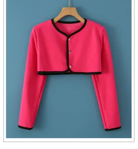 Close-up of rose red thermal shoulder wrap with black trim and three button closure