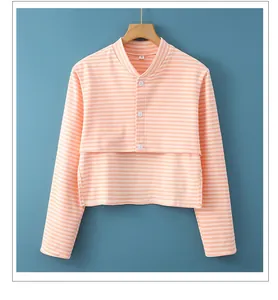 Detail of pink and white striped thermal shoulder wrap with buttoned stand collar