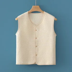 Padded beige quilted warm vest for kids featuring a V-neck and wooden button closure