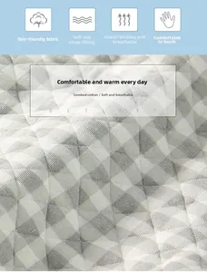 Close-up of breathable quilted combed cotton fabric with soft grey checkered texture