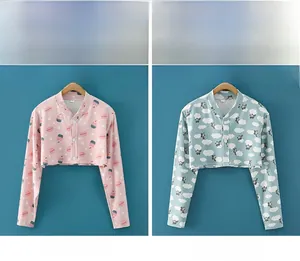 Detail of thin cotton shoulder shrugs in Ice Cream Pink and Blue Cloud patterns