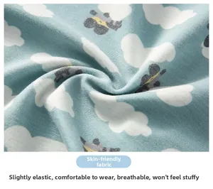 Detail of breathable light blue cotton fabric with sheep pattern and soft texture