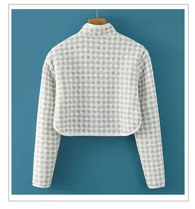 Rear view of quilted cotton shoulder warmer with grey gingham pattern and stand collar