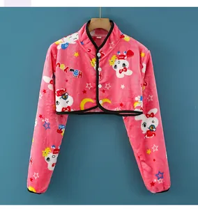 Detailed texture of pink flannel shoulder warmer with bunny prints and white buttons