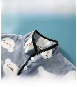 Detail of the warm flannel shoulder wrap featuring a mandarin collar and bear pattern