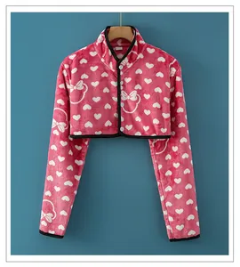 Detailed view of pink flannel shoulder wrap with white hearts and soft fleece texture